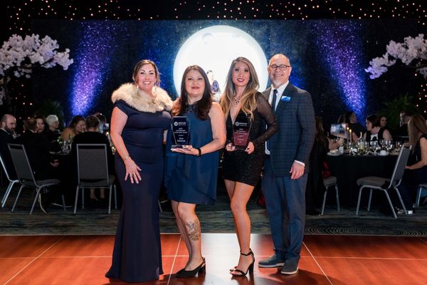 Victoria Lo and Dina Wiseman accept their award