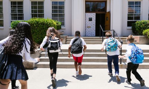 Kids running into school