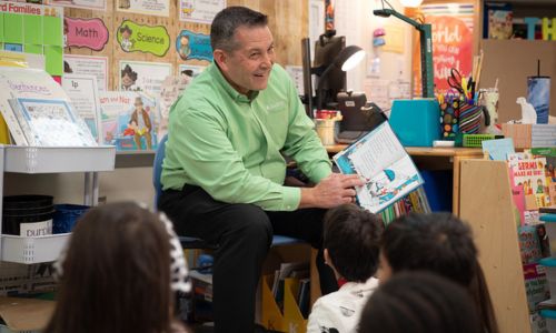 DATCU CEO Glen McKenzie reads to elementary students