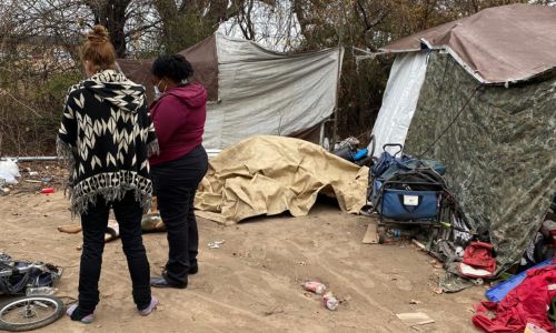 Volunteers survey in encampment